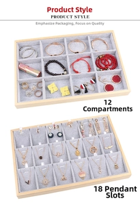 Macro view of wooden jewelry tray with gray velvet slots for necklaces and pendants