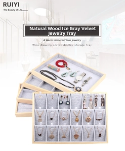 Detail of 18-grid wooden jewelry organizer with ice grey velvet lining for pendants