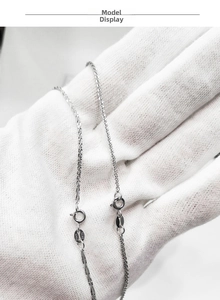 Macro detail of S925 sterling silver chain with ITALY hallmark and spring ring clasp