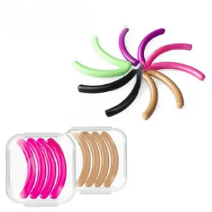 Macro view of multi-color silicone lash lift pads with transparent storage cases