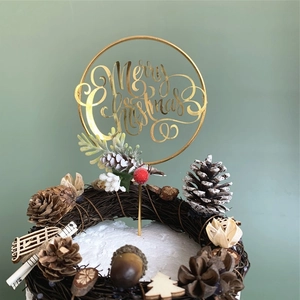 Golden Merry Christmas cake topper with rustic red berries and pinecone wreath