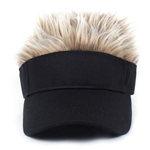 Detail of black cotton visor featuring fluffy light brown synthetic wig hair on top