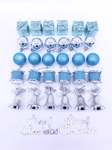 Detailed flat lay of a 32-piece blue and silver Christmas tree ornament set with bells