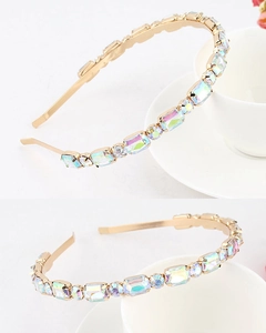 Macro shot of gold headband with iridescent rectangular crystals and pearls