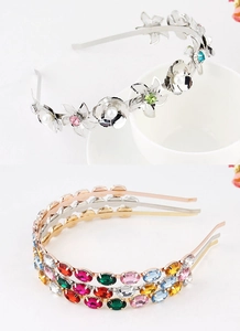Detail of floral metal headband with pearls and colorful rhinestones in multiple colors