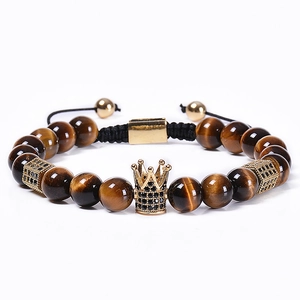 Natural tiger eye beaded bracelet featuring a gold crown and micro-pave black zircon accents