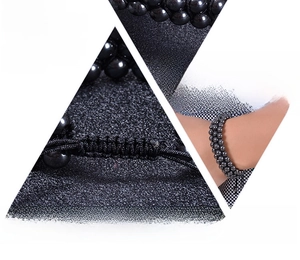 Detail of adjustable woven cord and 6mm magnetic hematite beads on triple layer bracelet