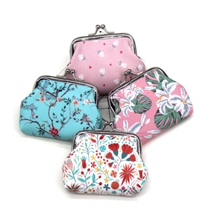 Floral coin purses with retro silver metal clasps in pink and blue fabric patterns