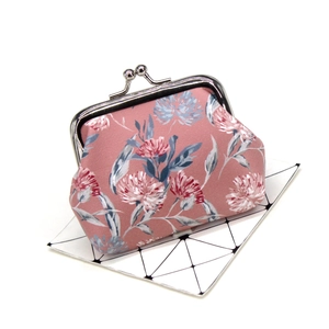 Detailed close-up of pink floral coin purse with vintage silver metal clasp closure