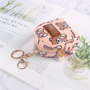 Pink mini backpack coin purse featuring a British bear print and pearl pendant detail
