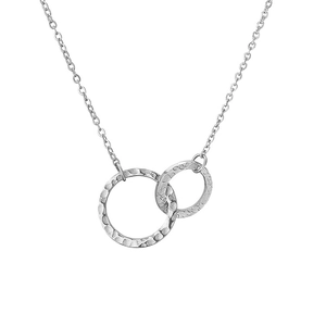 Detailed view of silver double interlocking rings with hammered texture on a cable chain