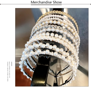 Detailed display of handcrafted pearl headbands with various bead sizes and gold metal frames