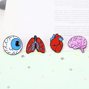 Enamel pins set with anatomical organs shapes like heart brain lung and eye icons