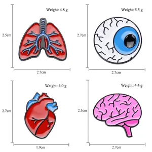 Set of 4 anatomical organ enamel pins featuring brain, heart, lungs, and eye illustrations