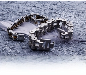 Detail of stainless steel bike chain bracelet showing brushed metal and bolt texture