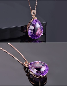 Macro shot of pear-shaped purple gemstone pendant necklace set in elegant rose gold finish