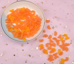 Macro shot of realistic resin orange segments for DIY phone case crafts and jewelry making