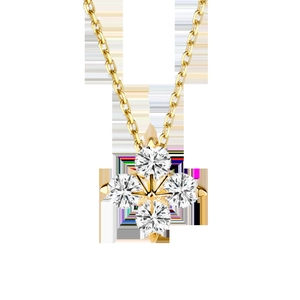 Detailed macro view of gold-plated 14K clover necklace pendant with four sparkling zircons