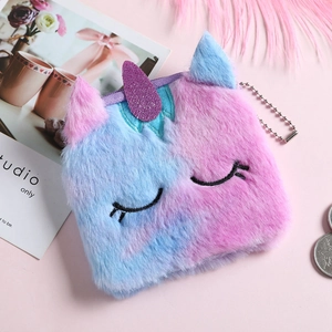 Close-up of plush unicorn coin purse with rainbow fur, sequins horn and metal chain