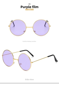 Detail view of round purple sunglasses with slim gold frames and black ear tips