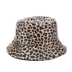 Close-up of leopard print bucket hat featuring a glossy faux leather texture and finish