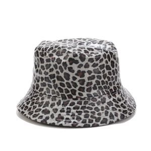 Close-up of leopard print bucket hat detail showing synthetic leather texture and finish