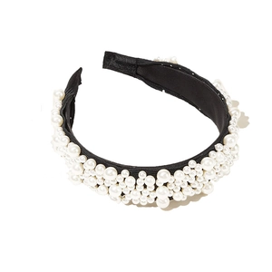 Elegant wide headband with geometric white pearls on black fabric for fashion party