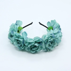Detailed shot of handmade teal fabric rose floral headband for bridal wedding hair style