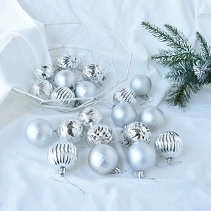 Detail of 5cm silver Christmas ornaments with glossy, matte and textured geometric surfaces