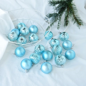 Detailed view of assorted light blue Christmas balls with matte and glitter textures