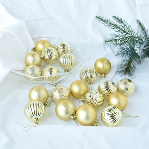 Close-up of golden Christmas ornaments in various finishes inside a white metal basket