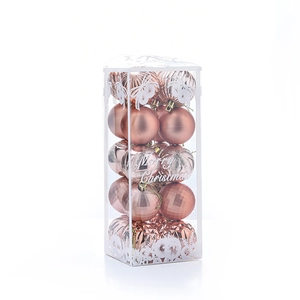 Close-up of 5cm rose gold Christmas balls with matte, glossy and glitter textures
