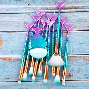 Detailed top view of 11-piece mermaid makeup brush set with gradient fishtail handles
