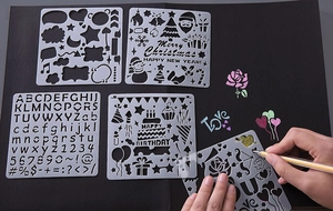 Macro detail of plastic painting stencils for DIY scrapbooking and holiday gift box decor
