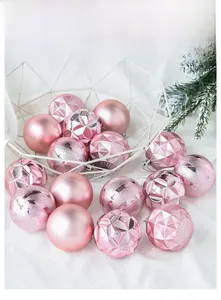 Detail of pink Christmas balls with matte and textured surfaces in a white basket