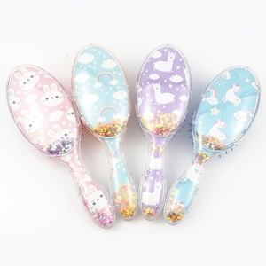 Detailed view of transparent air cushion hairbrushes with glitter and cartoon patterns