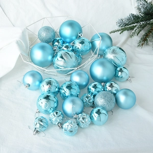 Detailed view of sky blue Christmas balls with glitter and matte finishes in a metal basket