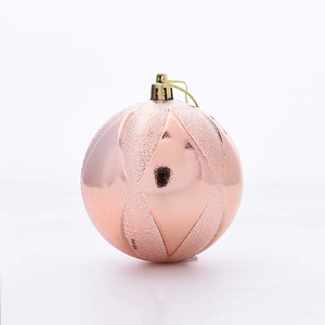 Detail of rose gold Christmas ball with matte and mirror geometric diamond texture finish