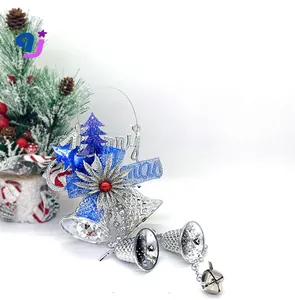 Detailed view of silver hollow bells and blue glitter stars for Christmas decoration