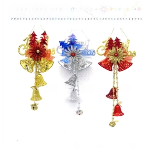 Close-up of gold, silver, and red Christmas bell hanging ornaments with festive bows