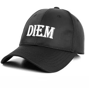 Close-up of DIEM letter embroidery and natural cotton texture on a black baseball cap