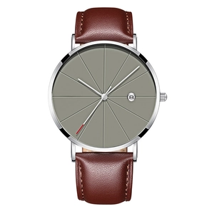 Macro detail of men quartz watch with grey sunburst dial and brown leather strap