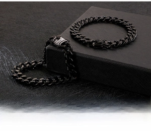 Detailed view of black Cuban link bracelet with sparkling rhinestones on the clasp