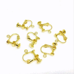 Set of 6 gold-plated screw earring converters for non-pierced ears on white background