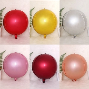 Close-up of 4D round aluminum foil balloons showing glossy metallic mirror texture