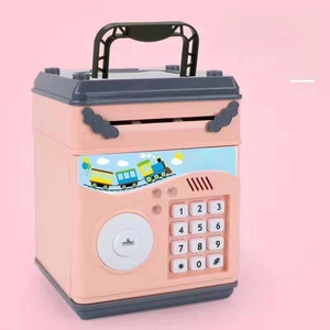 Pink ATM money box featuring digital keypad and cute train sticker for children