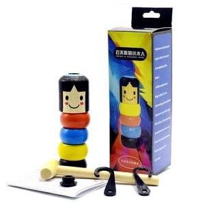 Detailed set of colorful wooden magic man toy with small hammer and manual components