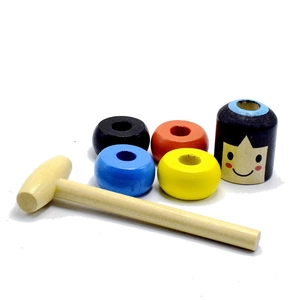 Detailed set of wooden magic toy pieces with colorful rings and a smiling character
