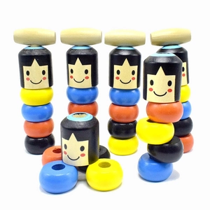 Detail of colorful wooden stackable puzzle toys with cartoon faces for child development
