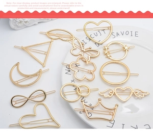 Detailed set of gold alloy hair clips featuring heart, bow, and star shapes